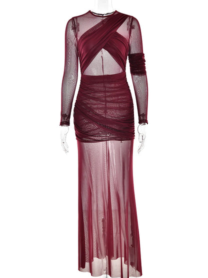 An elegant, figure-hugging, sexy, double-layered, sheer-look, long-sleeved party, club, and evening dress with mesh and patch details.